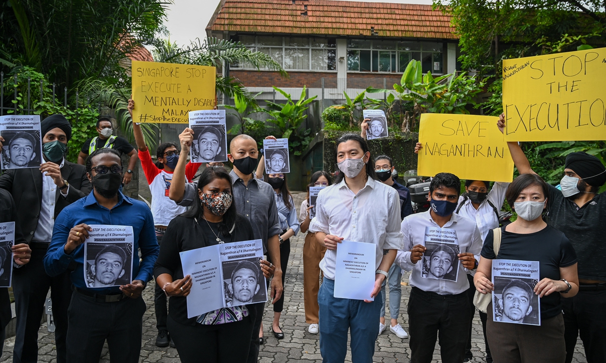 Activists hold placards in protest at the impending execution of Nagaenthran K. Dharmalingam, sentenced to death for trafficking heroin into Singapore but diagnosed as intellectually disabled, in Kuala Lumpur, Malaysia on Wednesday. They said the execution of Nagaenthran would be a violation not only of international treaties but also of the Singapore constitution. Photo: AFP 